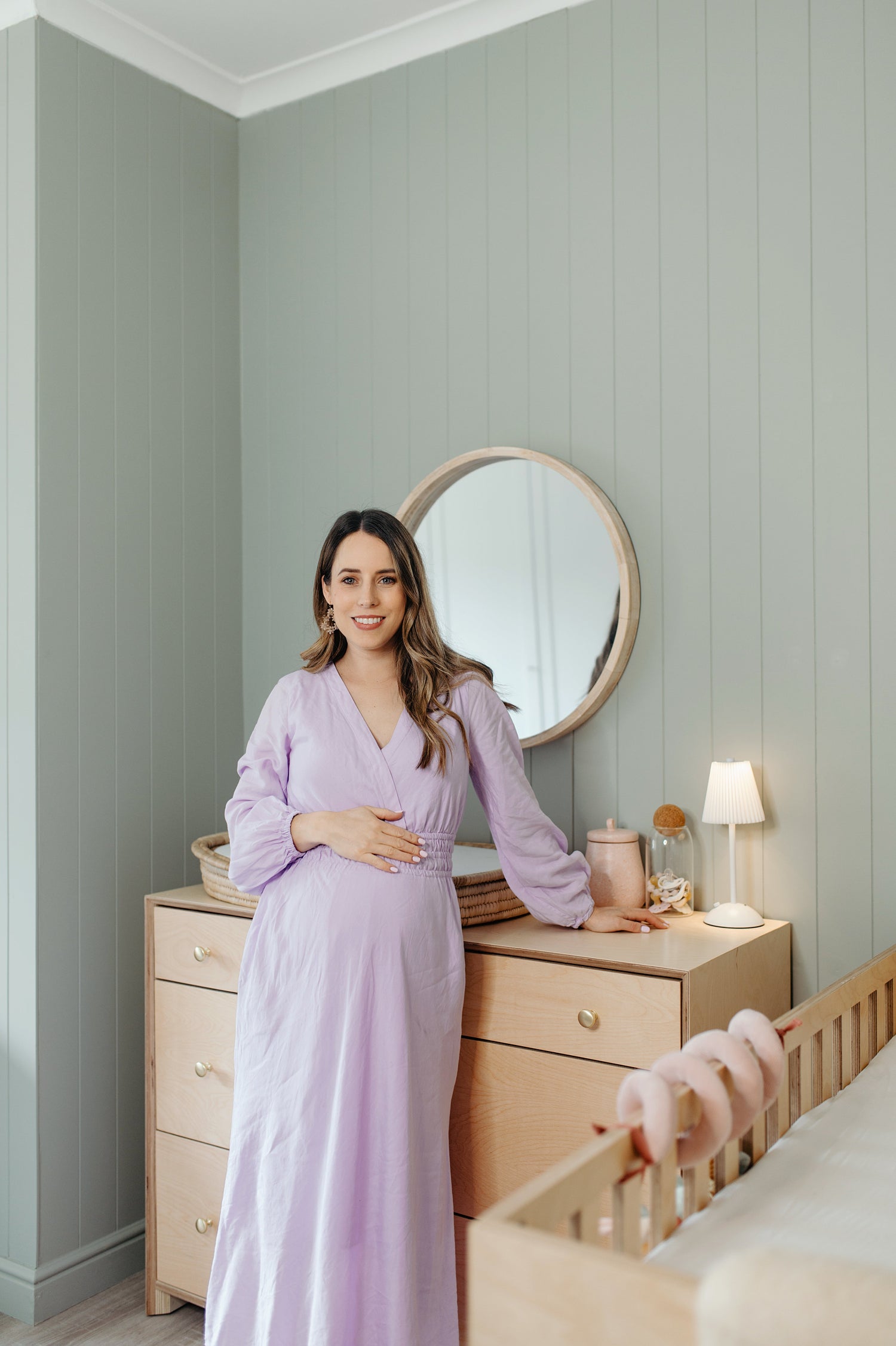 Full Lora nursery setup featuring cot, compactum, feeding chair, and shelving.