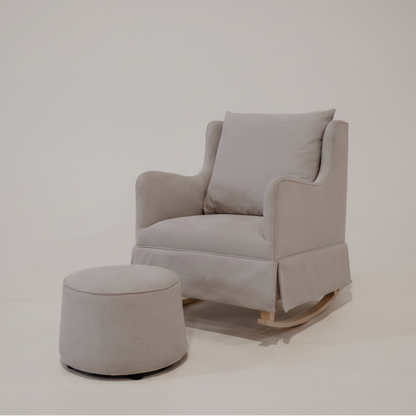 Gray rocking chair with matching ottoman on a white background