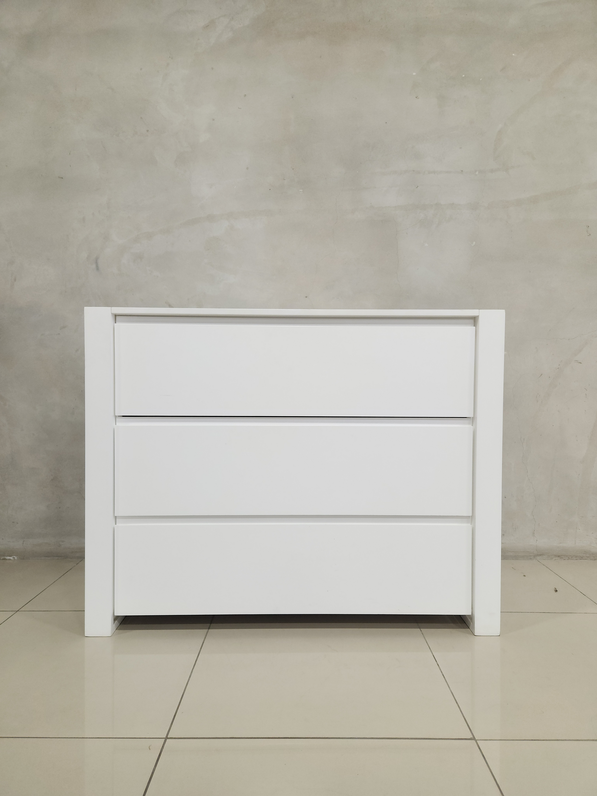 Best-selling Square Frame Compactum in all-white with spacious drawers for nursery organization.