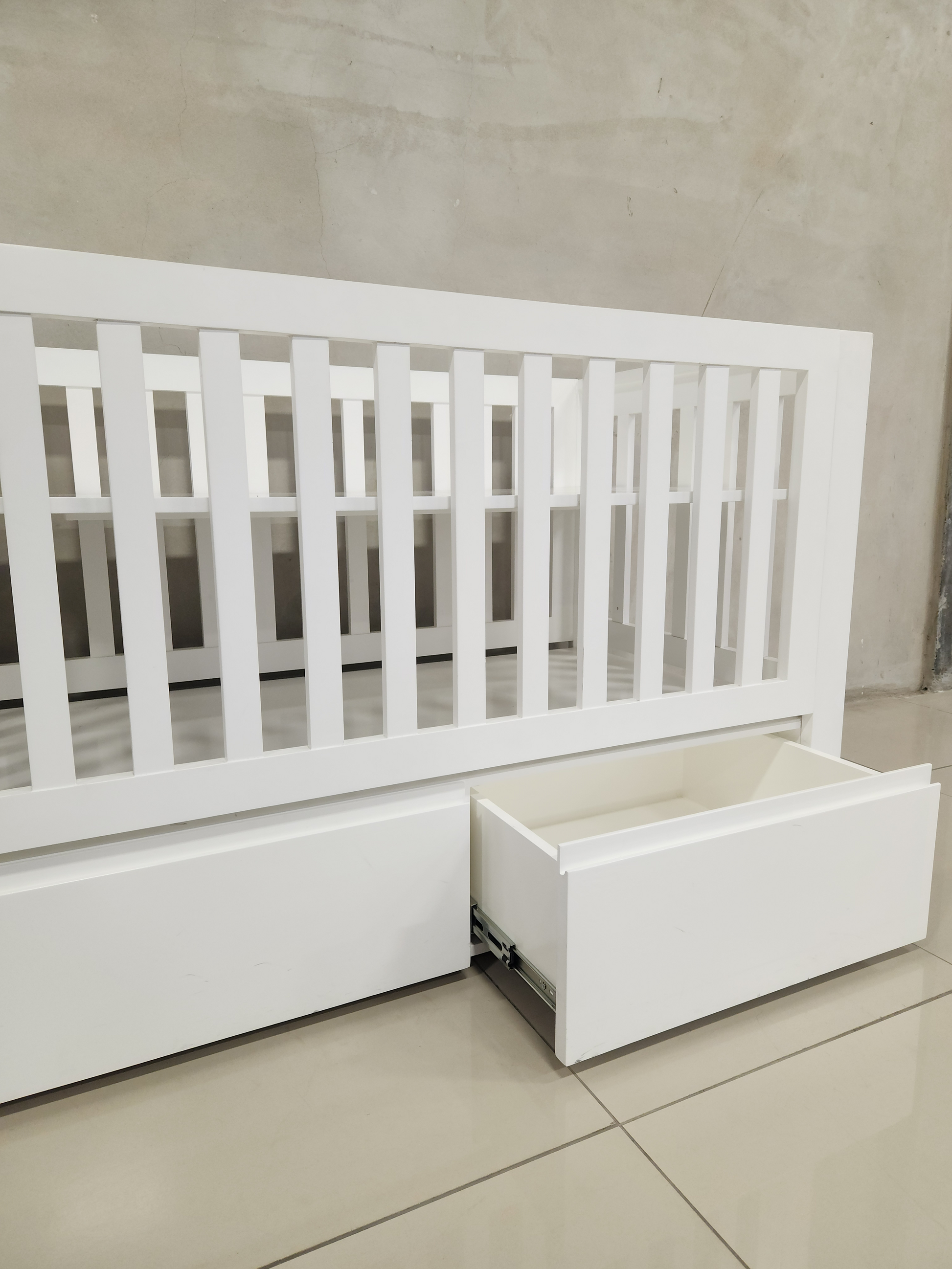 Convertible Square White Frame Cot with sleek design and extra storage, ideal for nurseries.