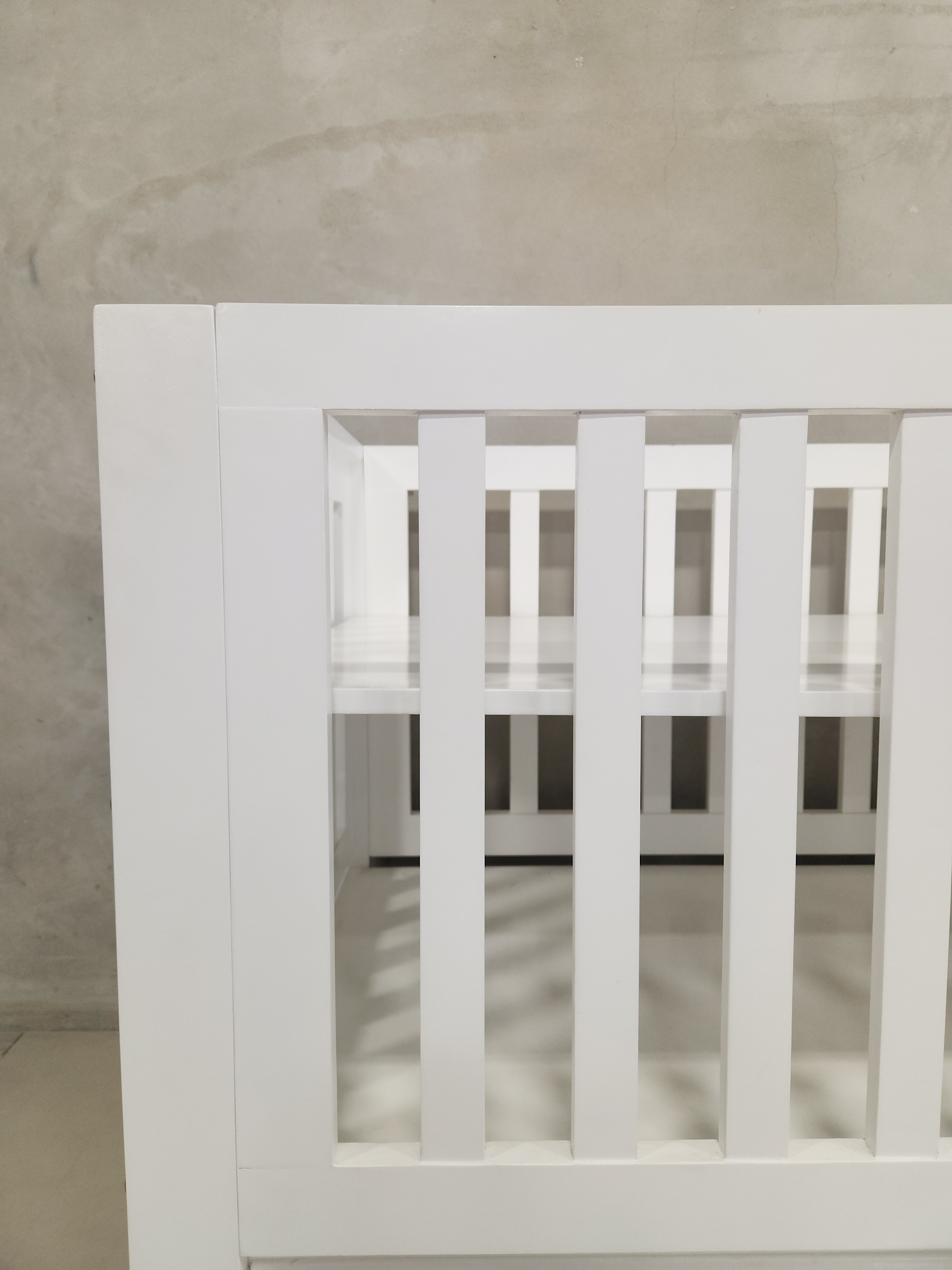 Modern Square White Frame Cot, offering toddler bed conversion and additional storage space.