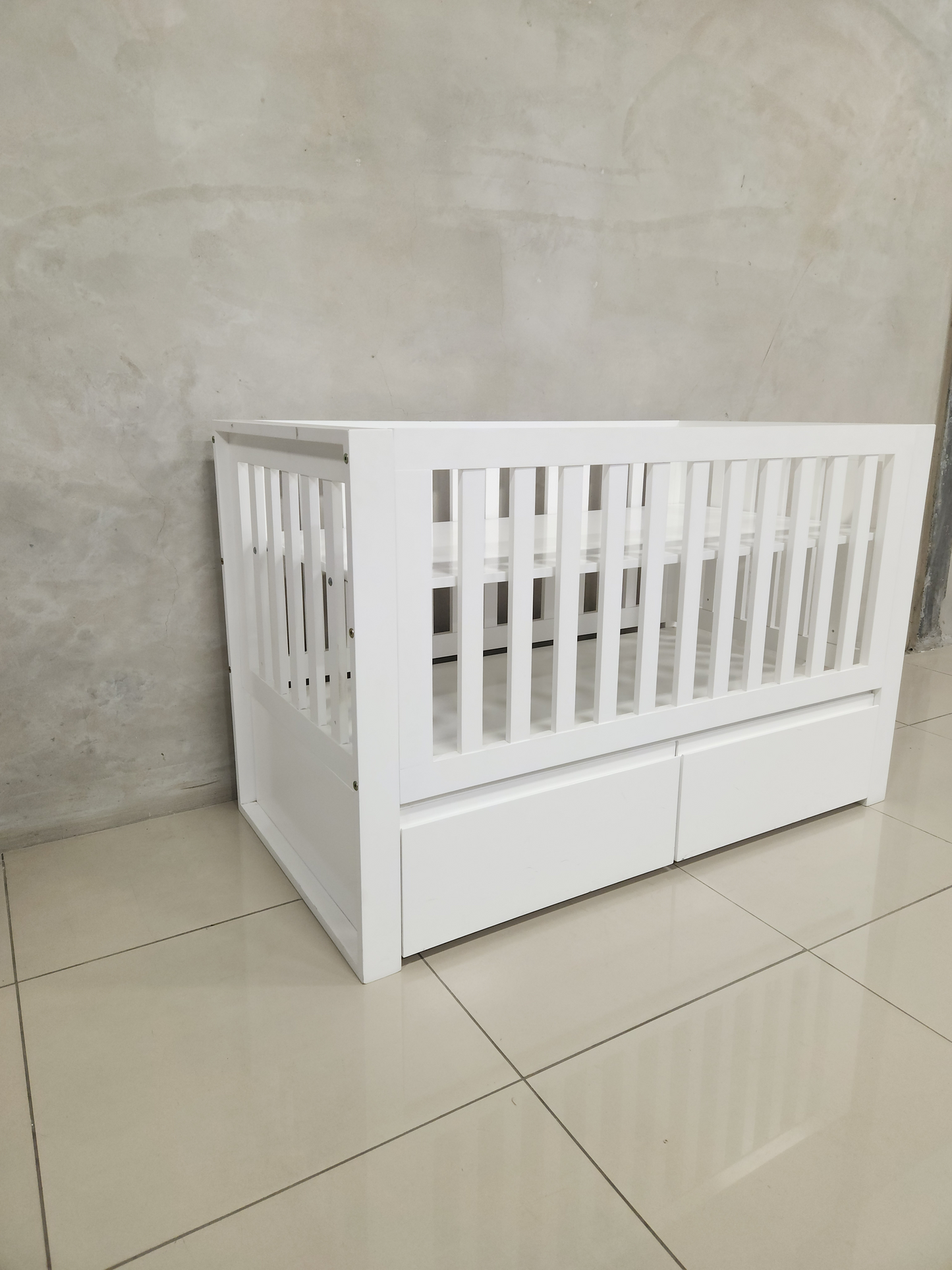 Convertible Square White Frame Cot with storage drawers, perfect for growing babies.