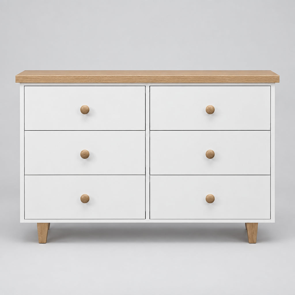 A modern 6-drawer dresser with a white painted finish, light natural oak top and legs, and round wooden knobs, shown against a neutral gray background.
