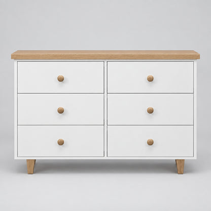A modern 6-drawer dresser with a white painted finish, light natural oak top and legs, and round wooden knobs, shown against a neutral gray background.