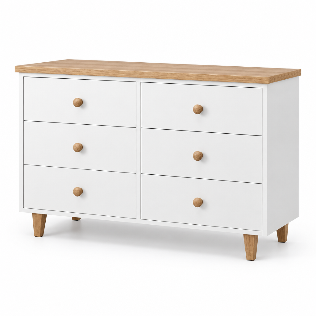 A white six-drawer dresser with a light wood top and round wooden knobs, styled with a gray basin, jewelry organizer, and small decor items against a white brick wall.