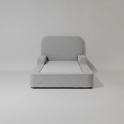 Gray upholstered kids bed on a white background