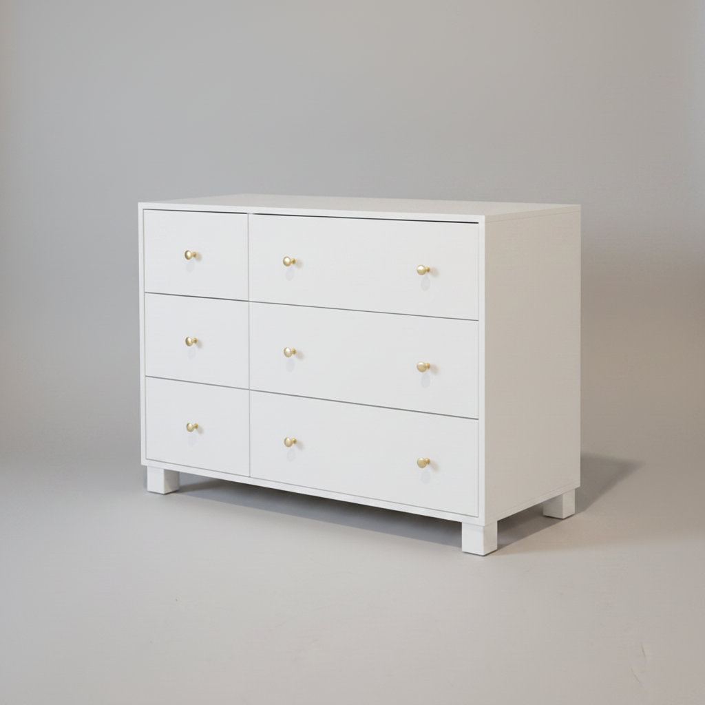 White nursery compactum with gold knobs on a gray background
