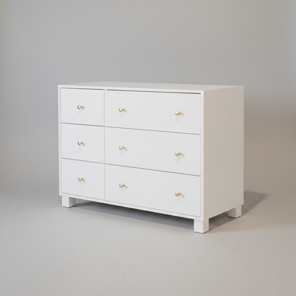 White nursery compactum with gold knobs on a gray background