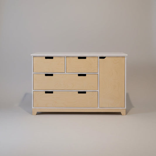Wooden dresser with multiple drawers against a white wall
