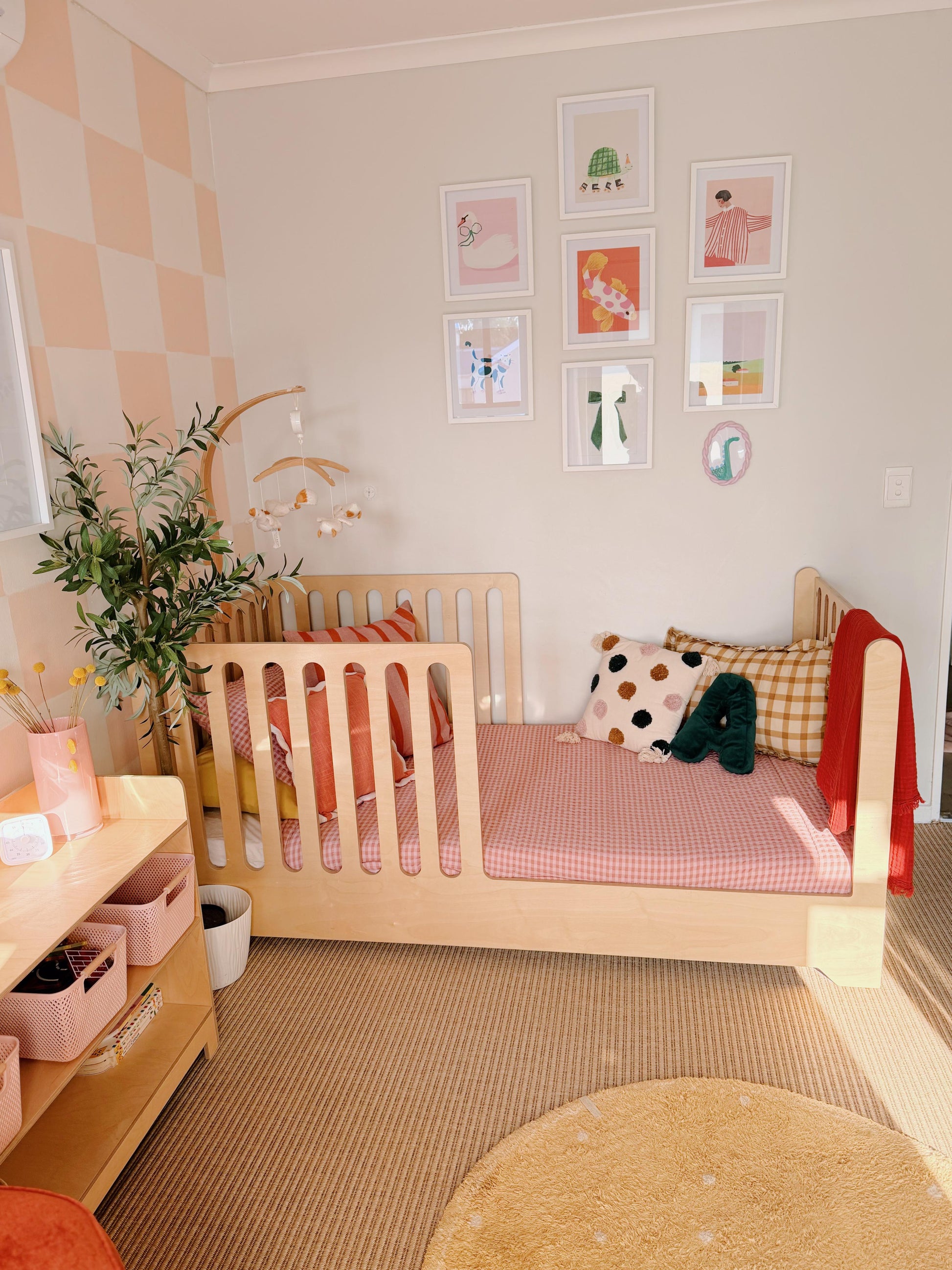 Children's bedroom with a crib, toys, and decorative elements.