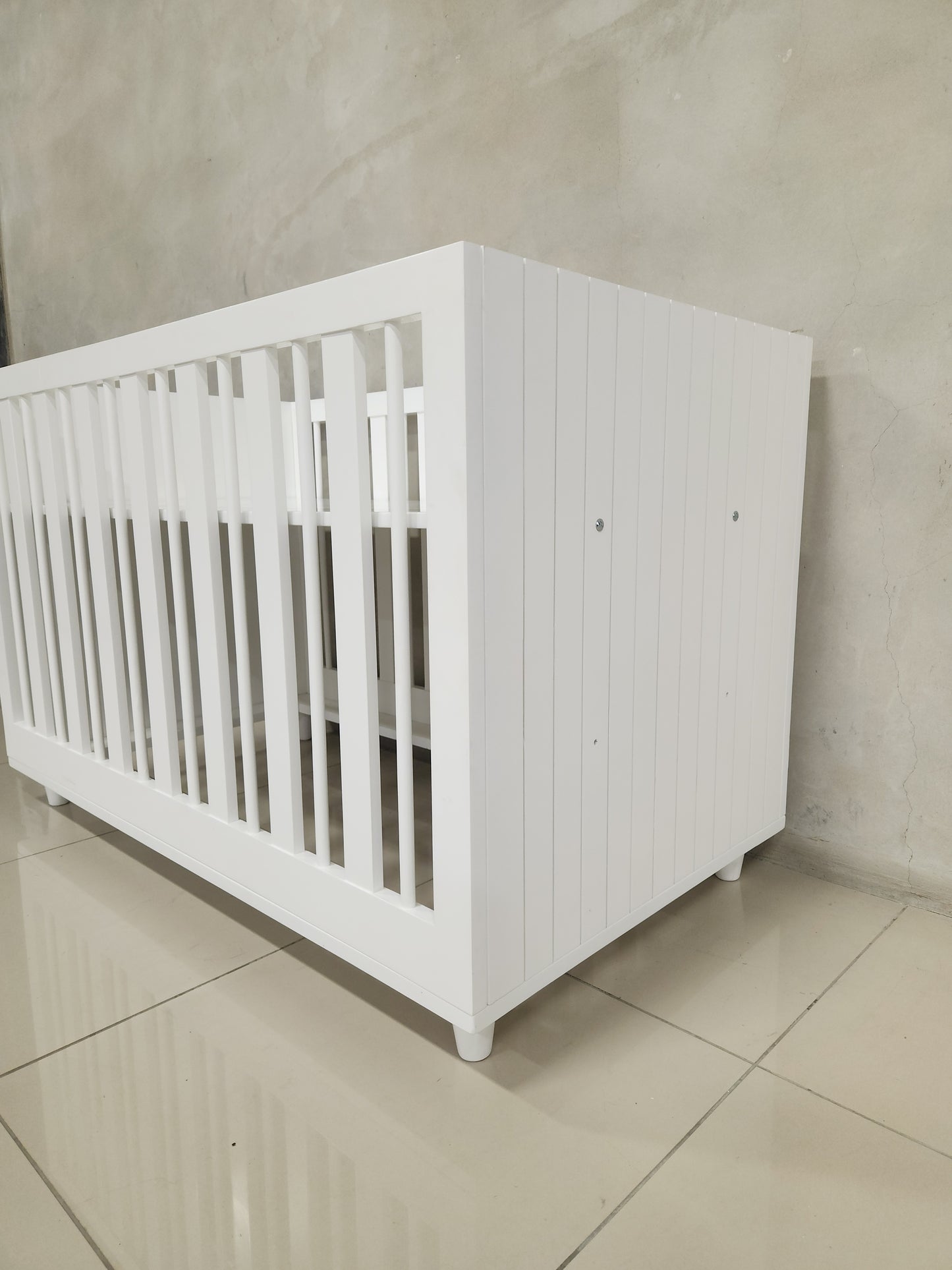 Line Cot featuring 3 mattress levels, ideal for safe sleep and modern nursery design.