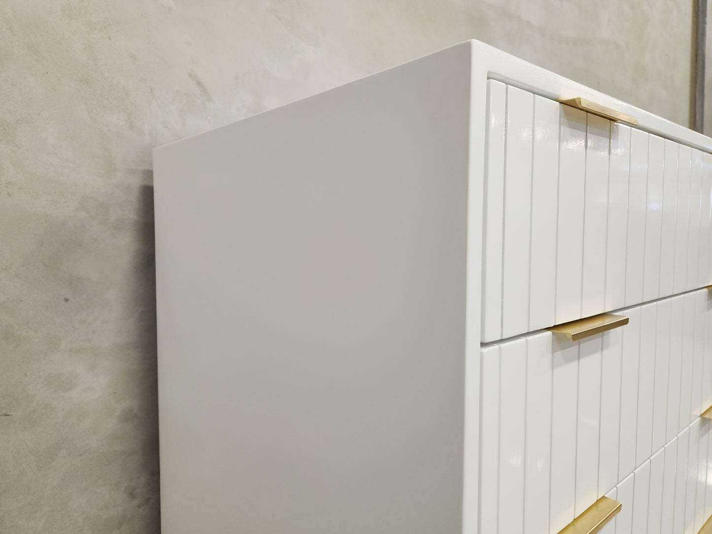 White Line Compactum with baby-safe materials, line detail, 4 drawers, and shelves for nursery organization.