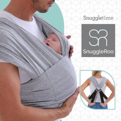 Parent wearing the SnuggleRoo Baby Carrier in the Newborn position, cradling a sleeping infant