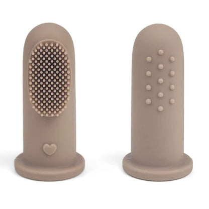 Close-up of BPA-free baby finger toothbrush on adult finger.