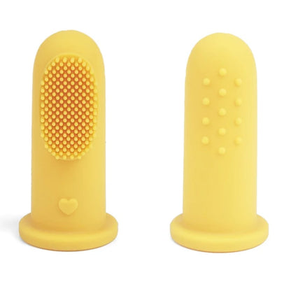 Close-up of BPA-free baby finger toothbrush on adult finger. - Yellow