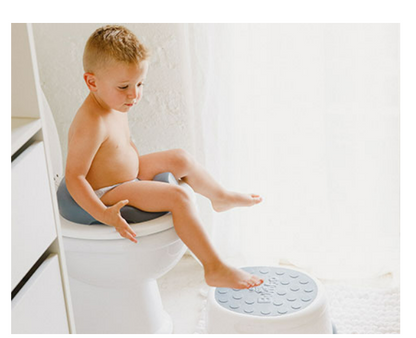 Toddler using Bumbo® Step 'n Potty as a toilet trainer.