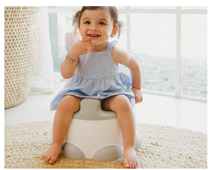 Toddler using Bumbo® Step 'n Potty as a toilet trainer.