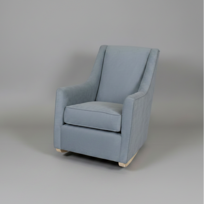 Blue armchair on a gray background
