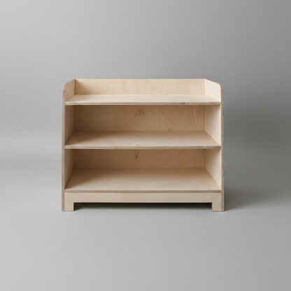 Wooden bookshelf with three shelves on a gray background