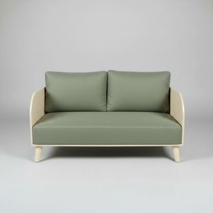 Green sofa with beige frame on a gray background
