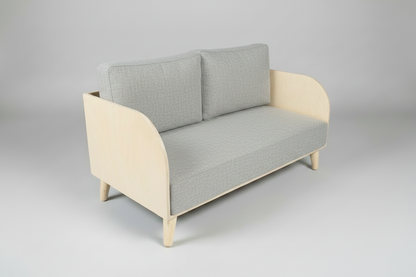 Sofa with dark gray cushions on a light gray background