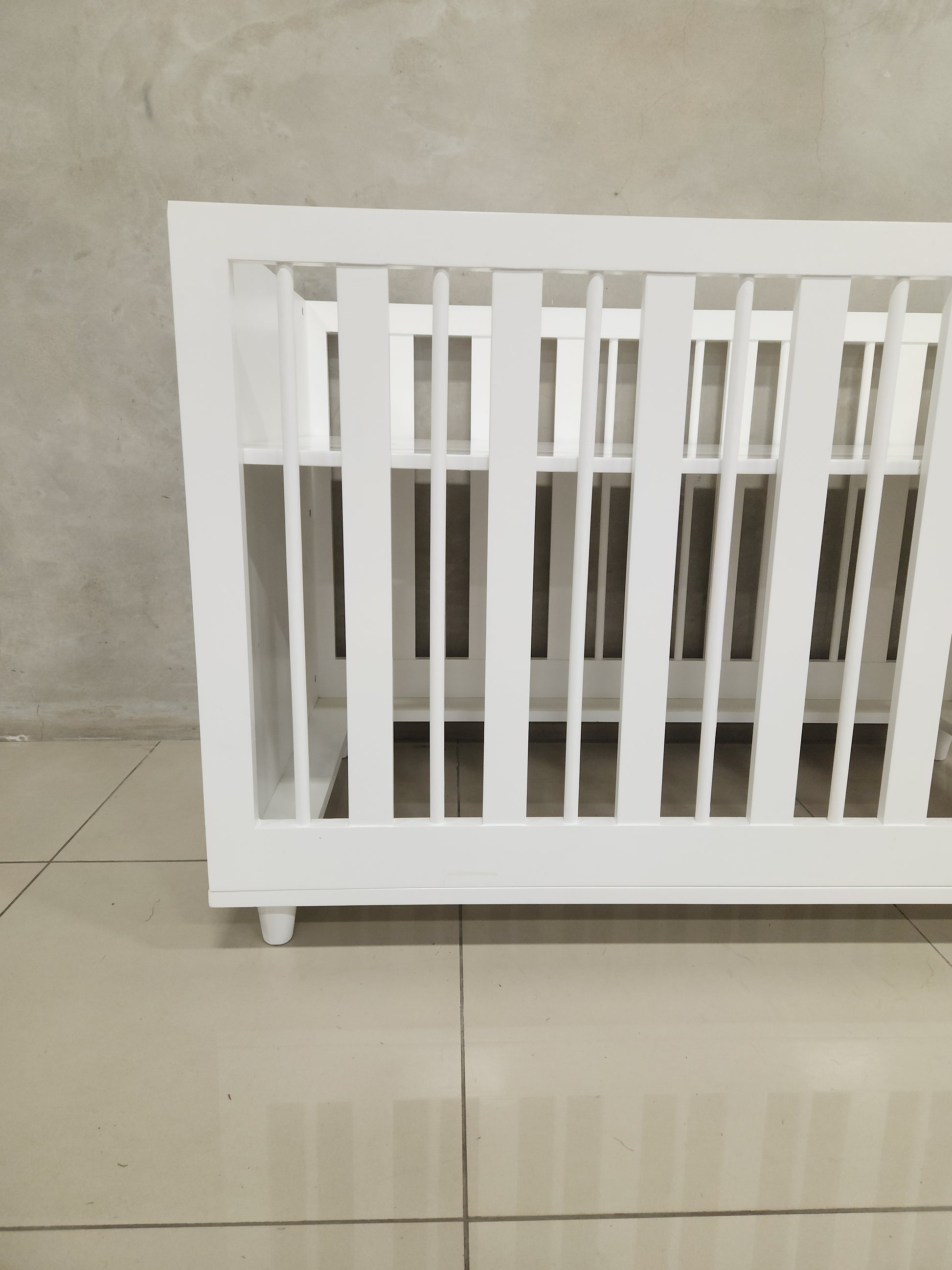 Adjustable Line Cot designed to grow with your baby, crafted from baby-safe materials.