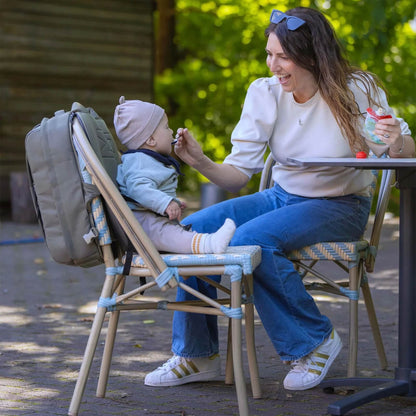 MiniMeis Backpack on a hiking trail, highlighting water-resistant design and storage.