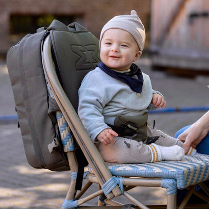 MiniMeis Backpack on a hiking trail, highlighting water-resistant design and storage.