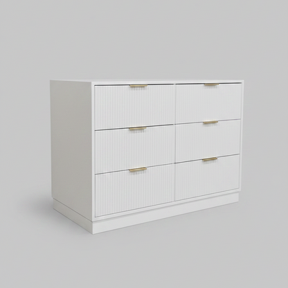 White dresser with gold handles on a gray background