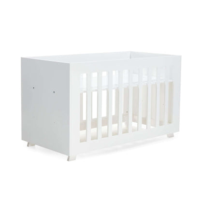 Pinkfoot Cot in white MDF styled in a modern nursery with plush bedding.