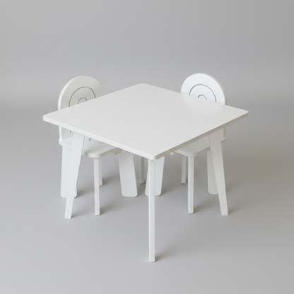 White children's table and chairs set on a gray background