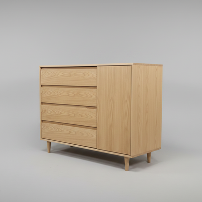 Wooden nursery compactum, dresser with a cabinet door and drawers on a gray background