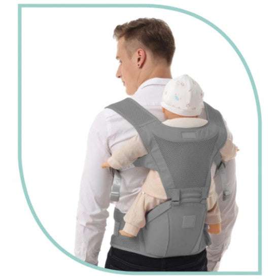 Parent wearing the Snuggletime Airflow Hip Seat Carrier in a front-carry position with baby