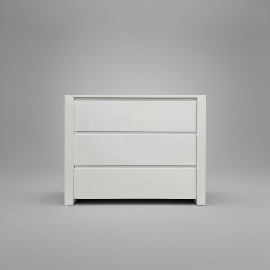 White nursery compactum with three drawers on a gray background