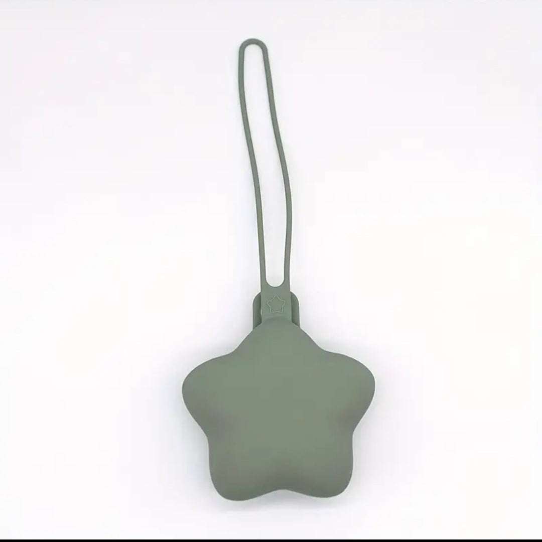 Star-shaped green silicone dummy holder on a white background