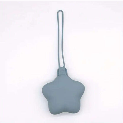Silicone baby teether on a white background with a shopping app icon at the bottom.