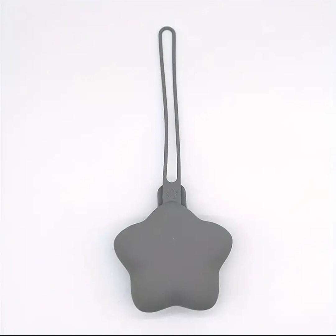 Gray star-shaped dummy holder with a handle on a white background
