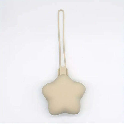 Star-shaped beige dummy holder with a string on a white background