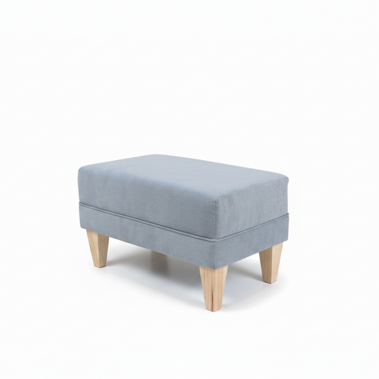 Gray upholstered ottoman with wooden legs on a white background