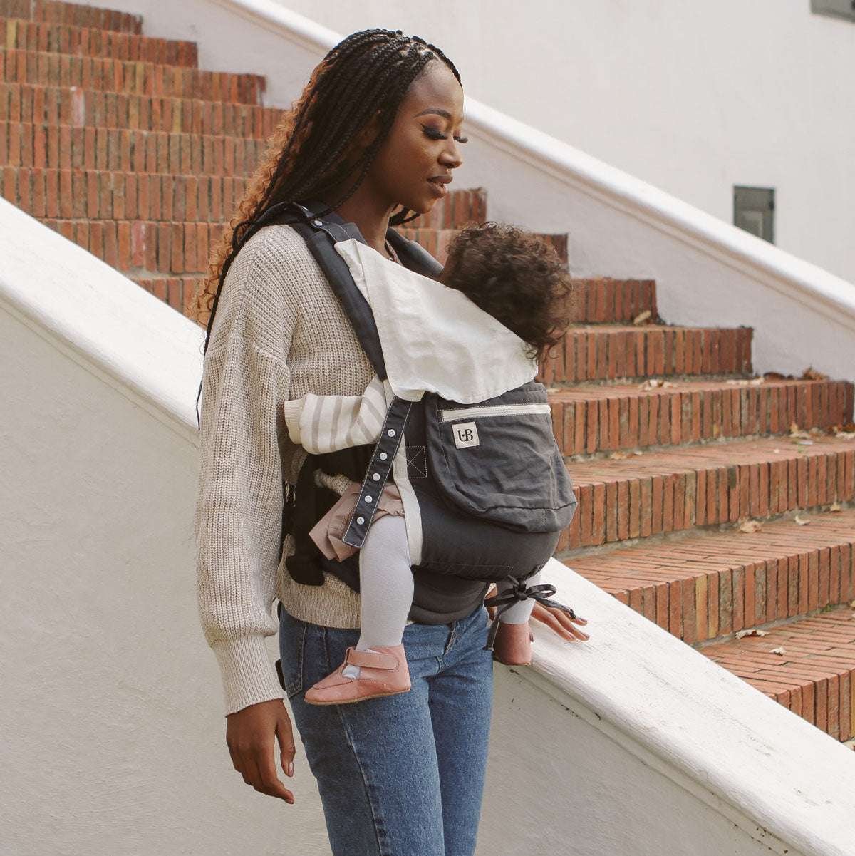 Lightweight baby carrier with breathable fabric, designed for comfort and support.